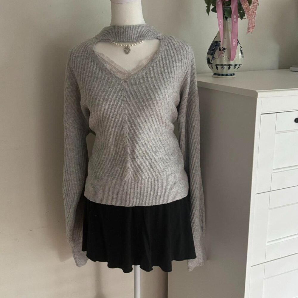 Grey long sleeve sweater with cutout V detail
